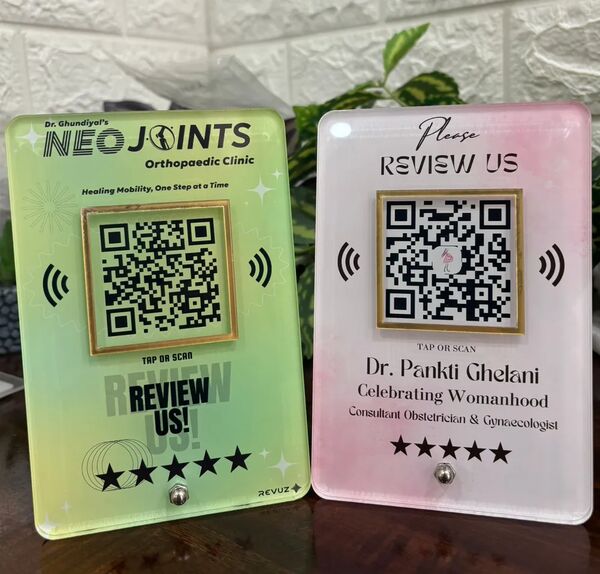 Revuz Luxe NFC and QR Google review standees on a counter
