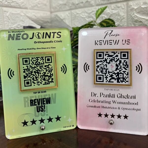 Revuz Luxe NFC and QR Google review standees on a counter